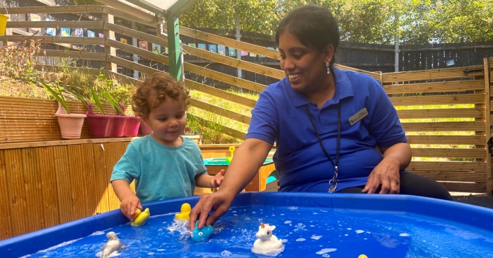 Safe play involving water, outside at Treetops Nursery, Willesden